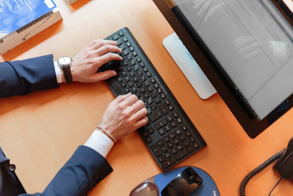 Someone typing on their keyboard, optimizing pmp deals